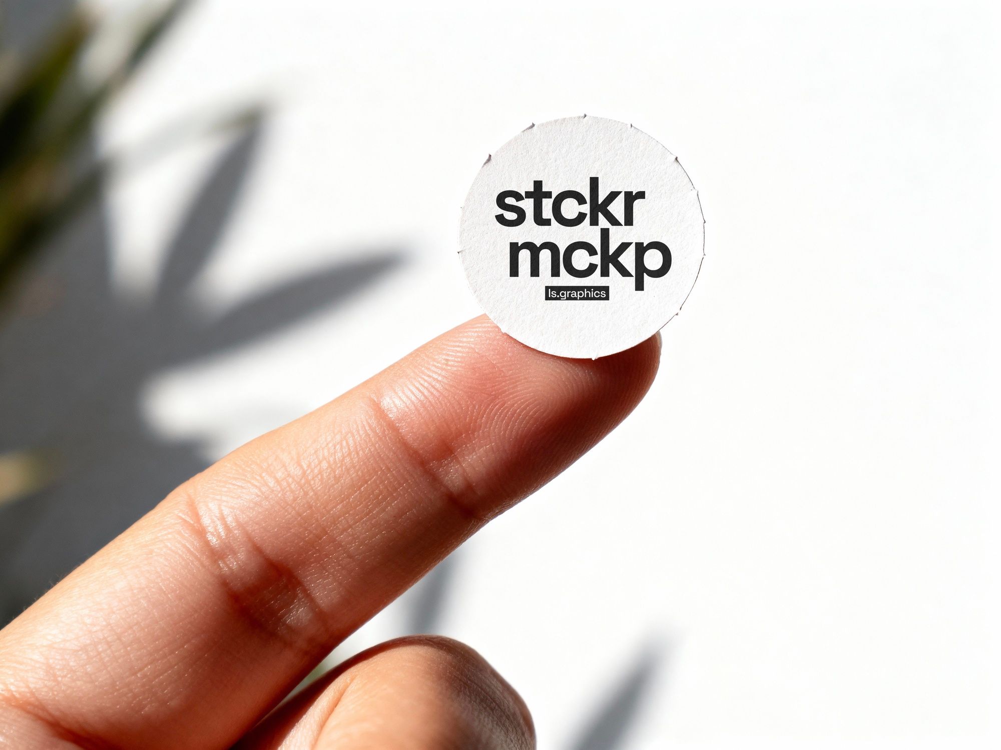 Round Sticker on Finger Mockup